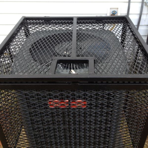 Black expanded metal machine guards are installed on the outdoor air conditioning system.