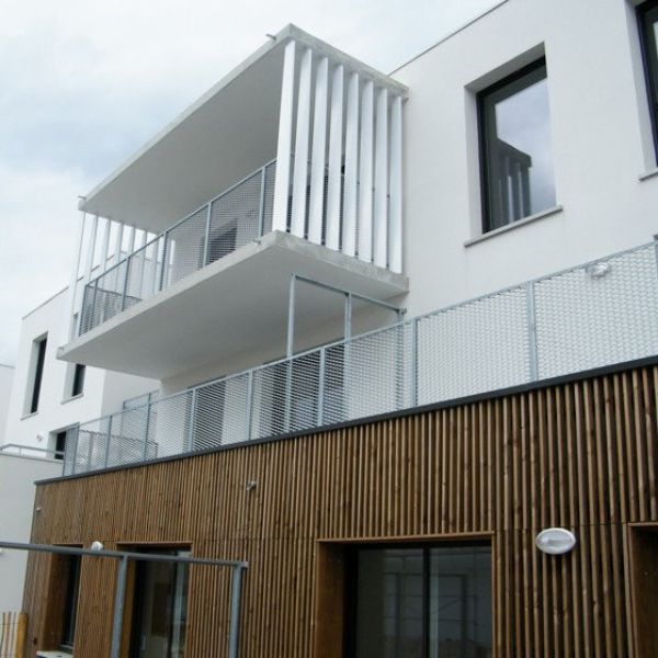 The balcony is equipped with expanded metal handrails.