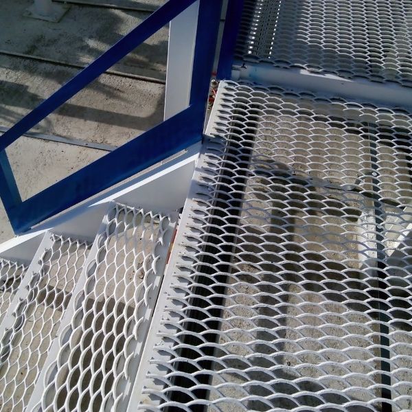 White expanded metal stair treads for stationary stairs