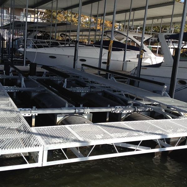 White expanded metal walkway is built above the water surface.