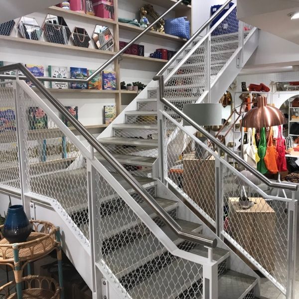 Expanded metal handrails are installed in the shop.